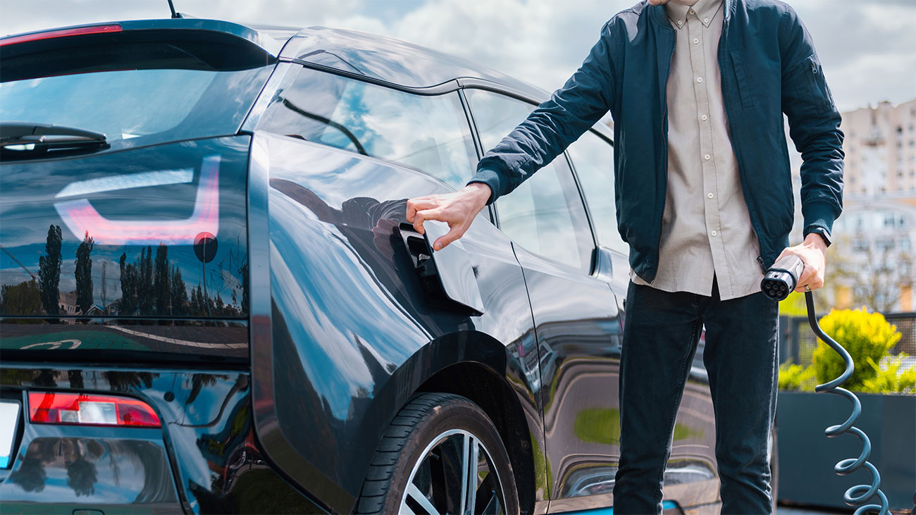 A boy is charging his car.