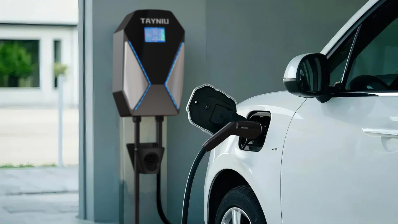 A Tayniu EV home charging station connected to a white electric vehicle, showing compatibility with various amperages for efficient charging.