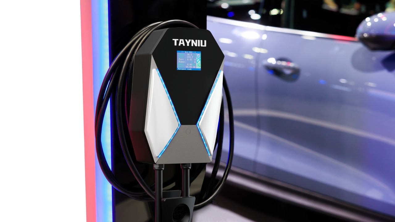 Wall-mounted Tayniu Level 2 EV Charger with LED indicators and cable management, perfect for modern electric vehicles.